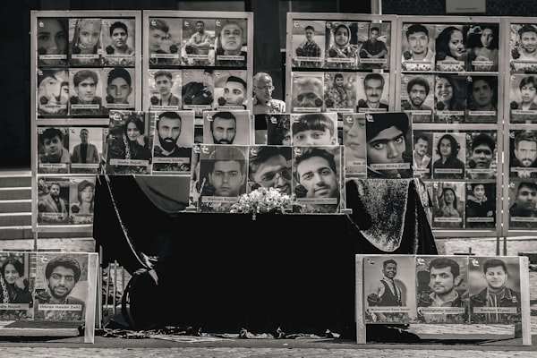 Portraits of lost lives displayed for remembrance.